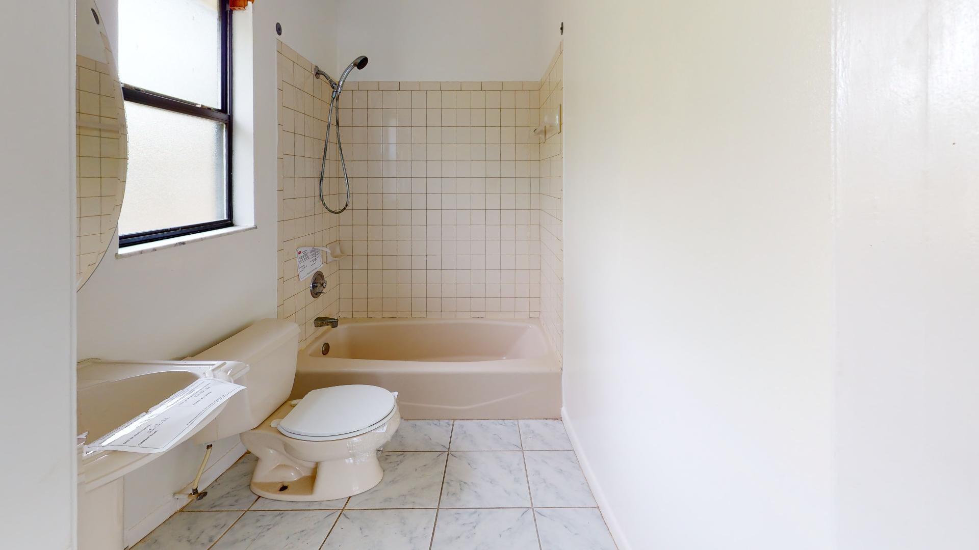29188 Tulip Lane Big Pine Key, FL 33043 - Photo 19 of 26 a bathroom with a toilet and a bath tub