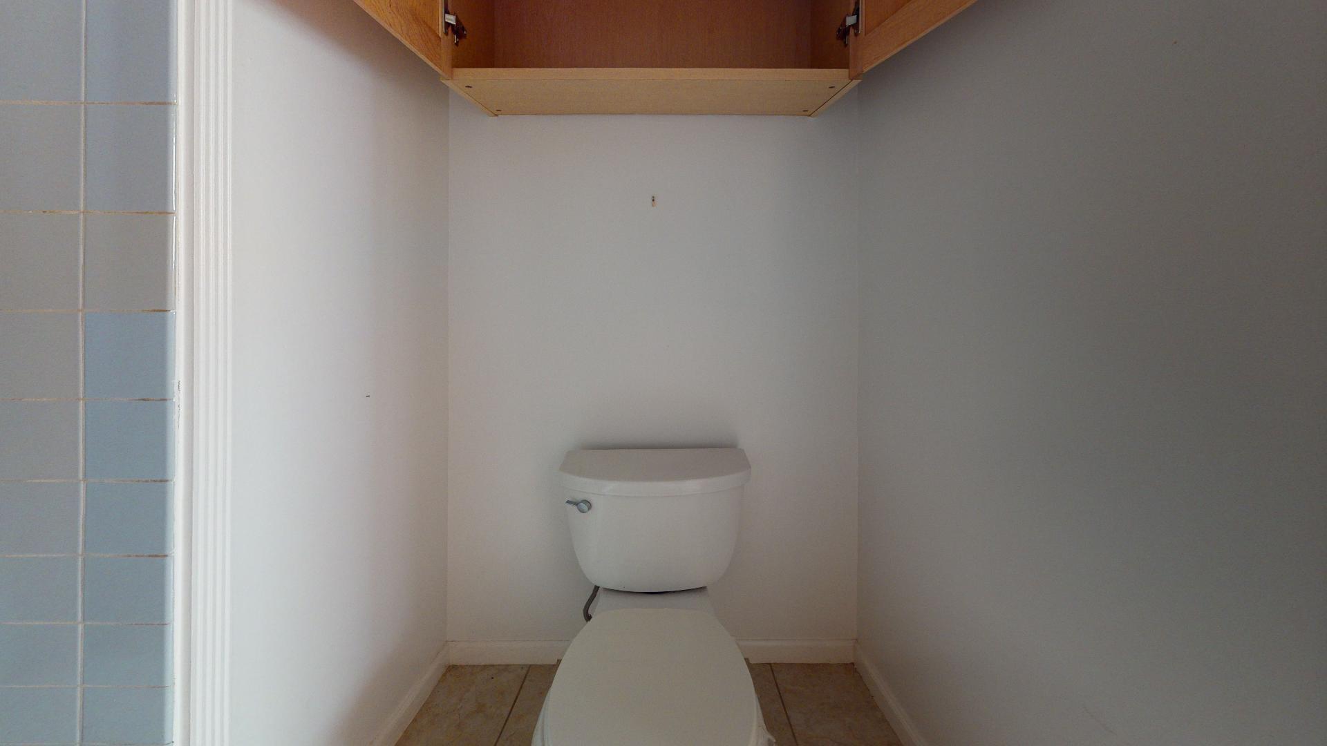 29188 Tulip Lane Big Pine Key, FL 33043 - Photo 20 of 26 a white toilet sitting in a bathroom