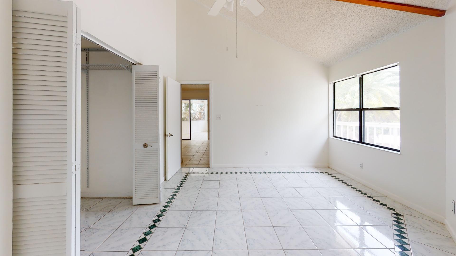29188 Tulip Lane Big Pine Key, FL 33043 - Photo 22 of 26 an empty room with windows and closet