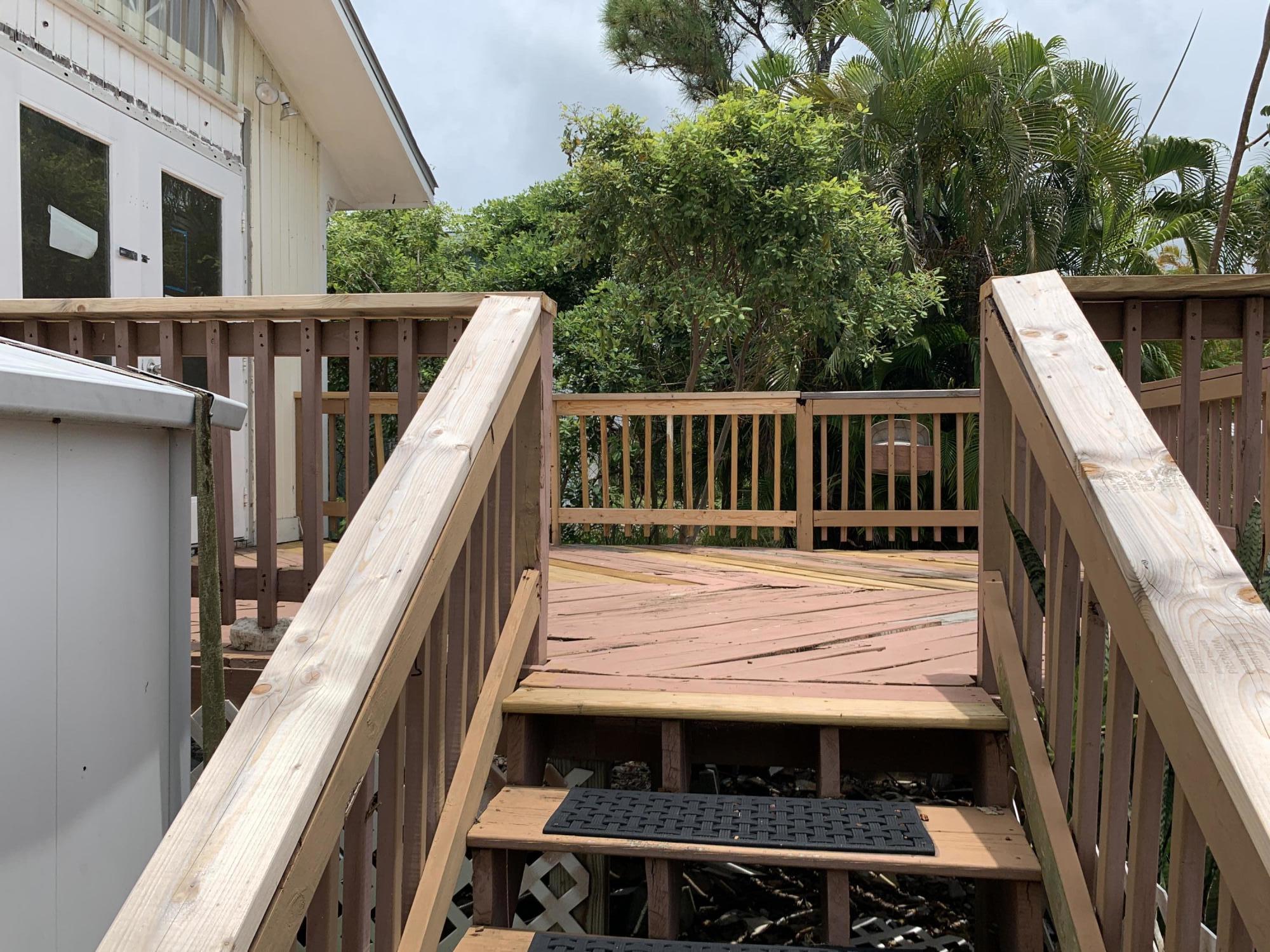 29188 Tulip Lane Big Pine Key, FL 33043 - Photo 25 of 26 a view of balcony with wooden floor and fence