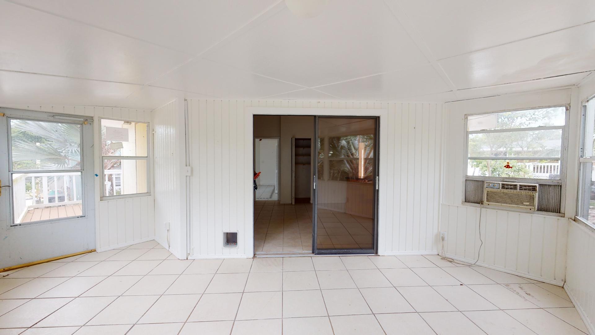 29188 Tulip Lane Big Pine Key, FL 33043 - Photo 10 of 26 a view of a entryway with kitchen and windows