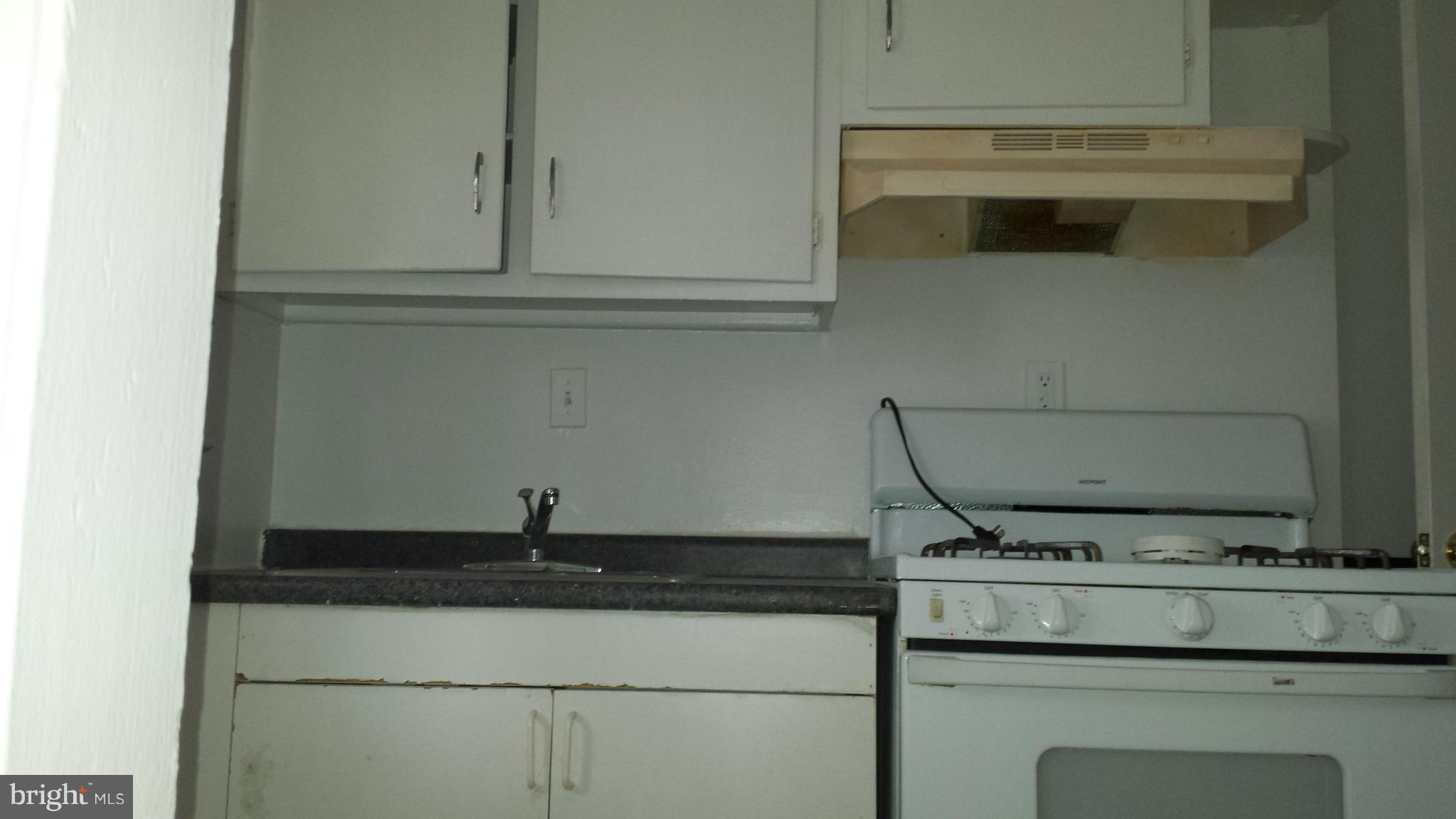 5803 3rd Street Northeast Washington, DC 20011 - Photo 4 of 20 a close view of a stove a sink and a microwave