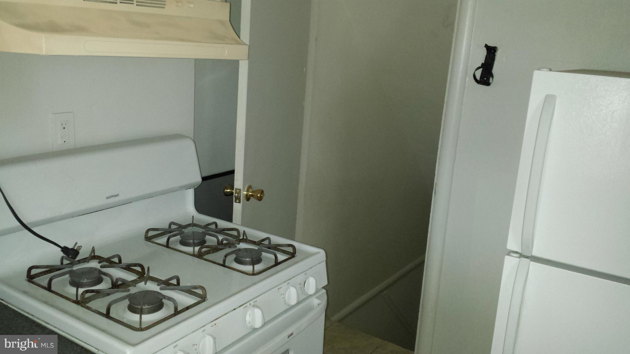 5803 3rd Street Northeast Washington, DC 20011 - Photo 6 of 20 a kitchen with a stove and a refrigerator