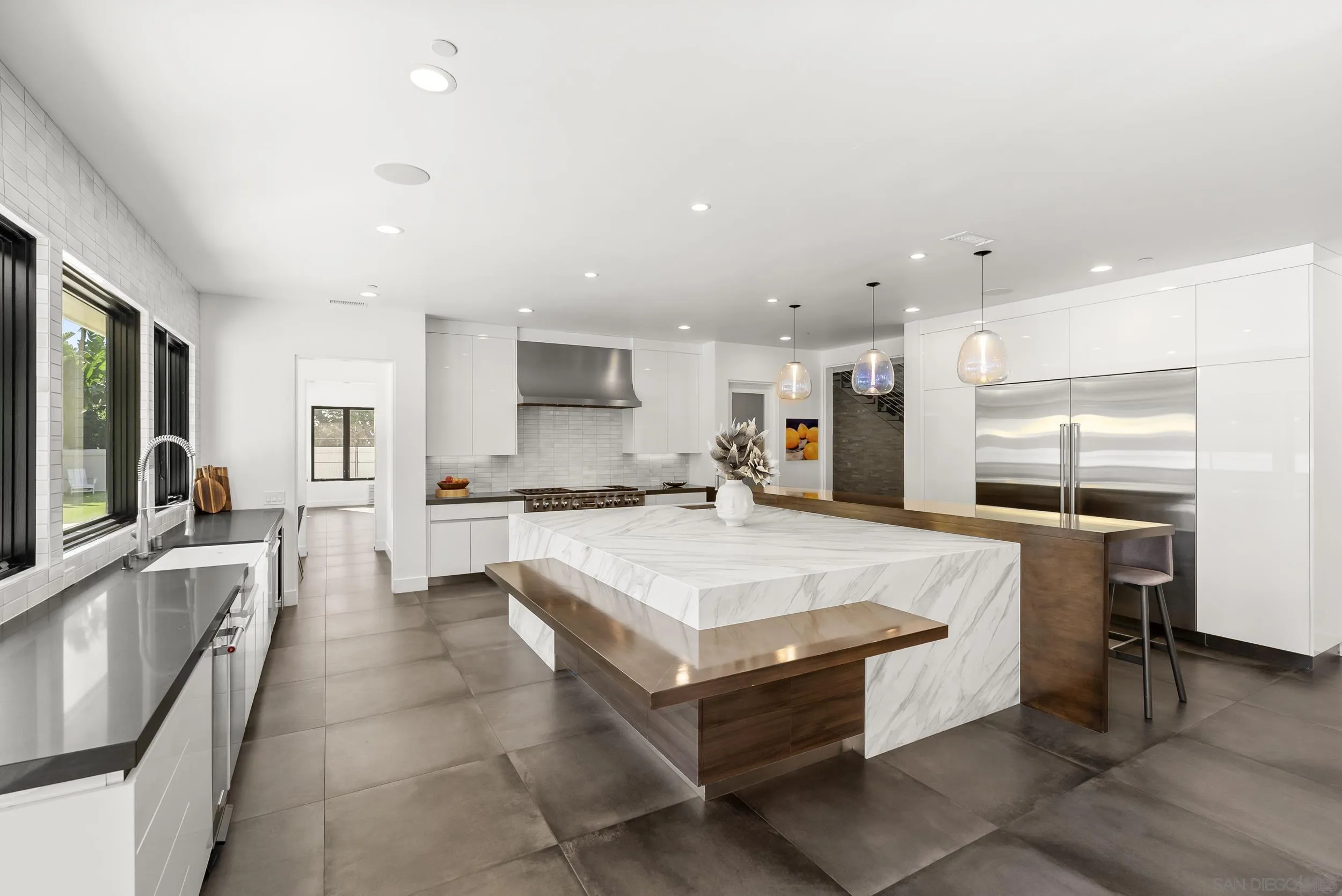6850 Avenida De La Ronda Rancho Santa Fe, CA 92067 - Photo 15 of 40 a large kitchen with a large counter top appliances and cabinets