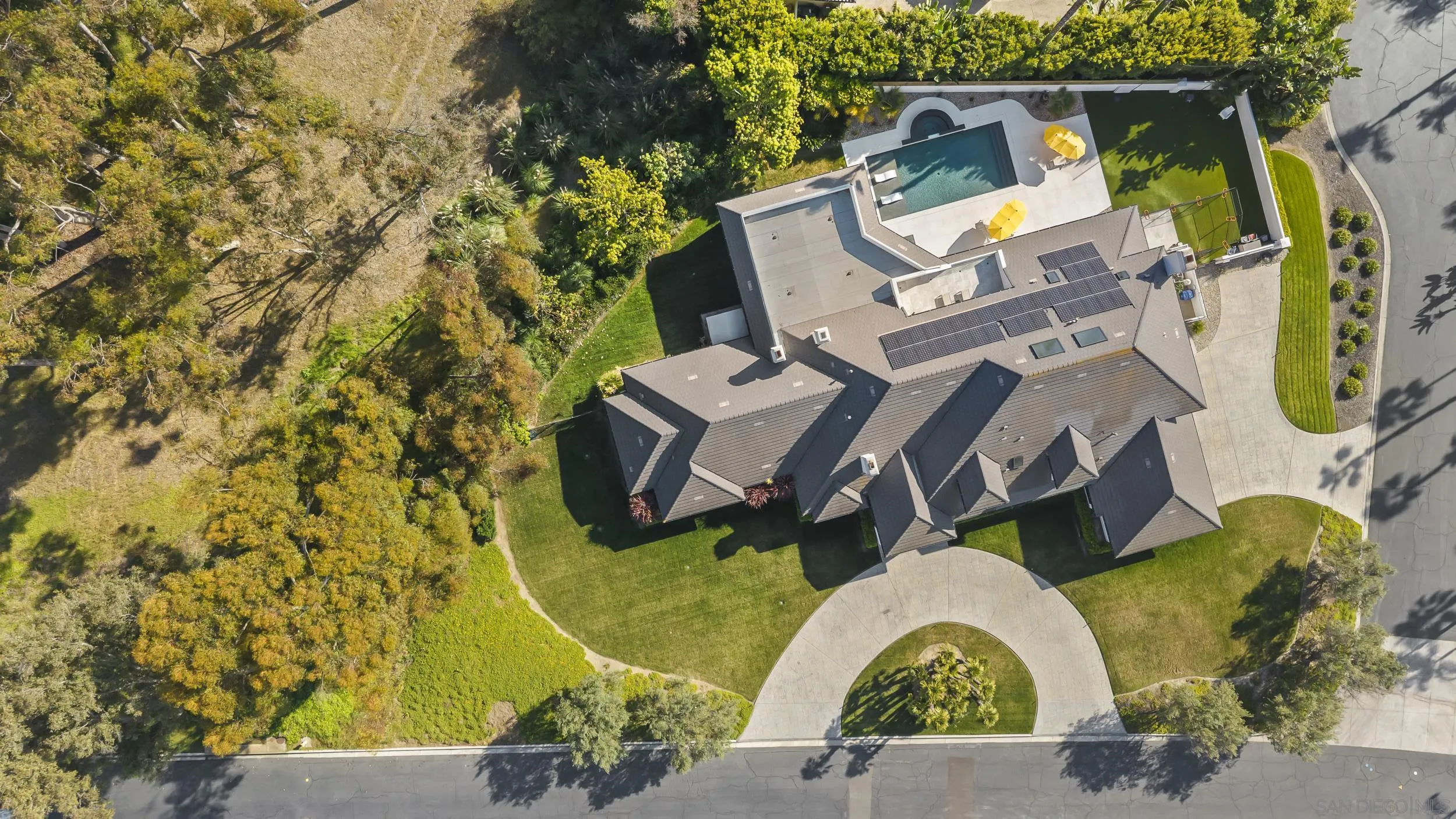 6850 Avenida De La Ronda Rancho Santa Fe, CA 92067 - Photo 34 of 40 an aerial view of a house with swimming pool and outdoor seating