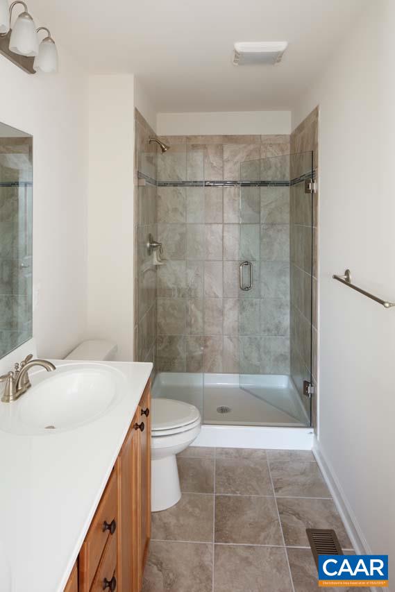 437 Rolkin Road Charlottesville, VA 22911 - Photo 10 of 26 a bathroom with a sink a toilet and shower