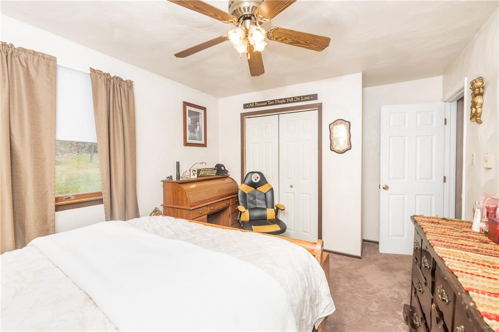1751 Poulos Road Indiana, PA 15701 - Photo 20 of 34 a bedroom with a bed and a chandelier