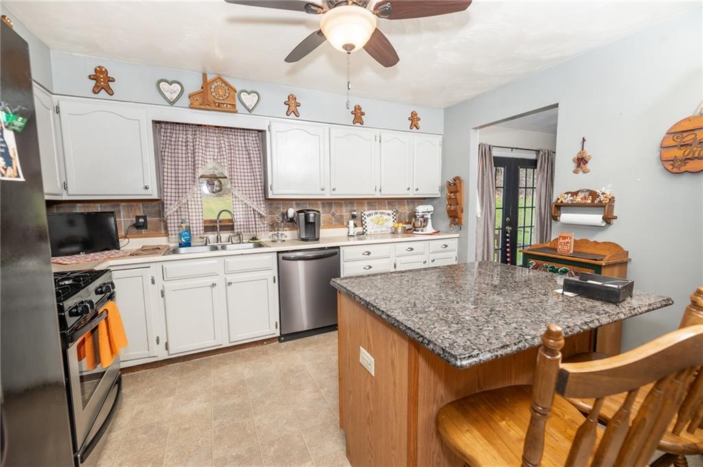 1751 Poulos Road Indiana, PA 15701 - Photo 8 of 34 a kitchen that has a lot of cabinets in it and appliances