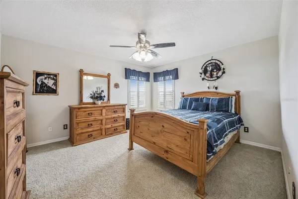 a living room with furniture and book shelf