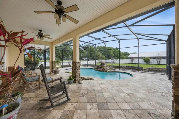 a view of a swimming pool with a lounge chairs