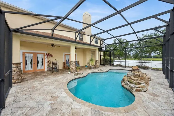 a view of a swimming pool with a porch