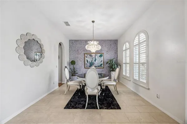a view of a dining room with furniture window and outside view