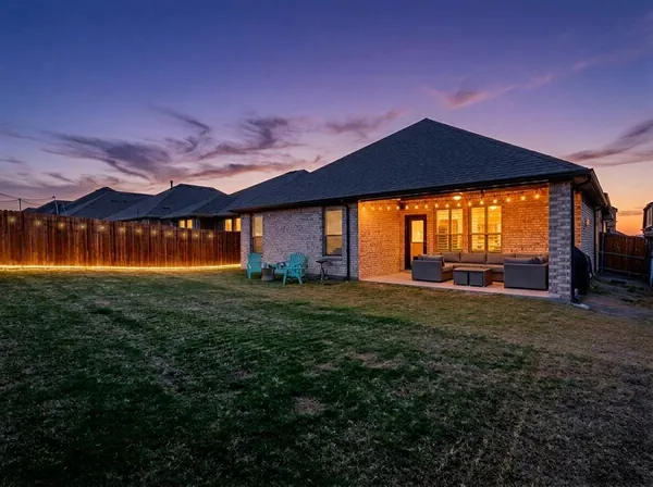 a view of a big house with a big yard