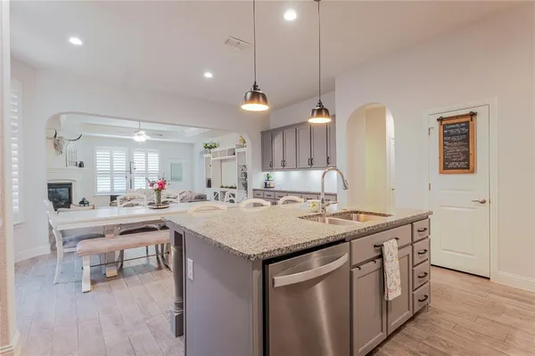a kitchen with a sink and cabinets