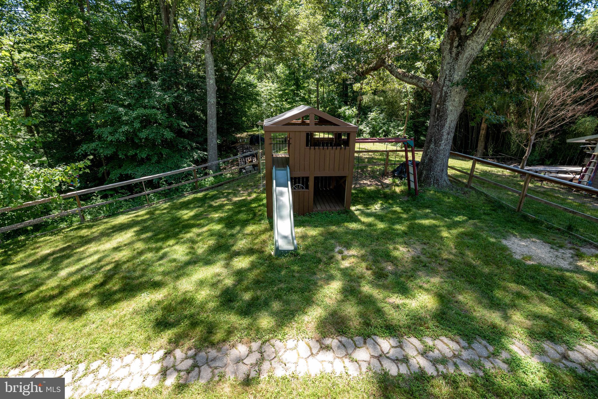 3930 Sixes Road Prince Frederick, MD 20678 - Photo 57 of 61 a backyard of a house with plants and large trees