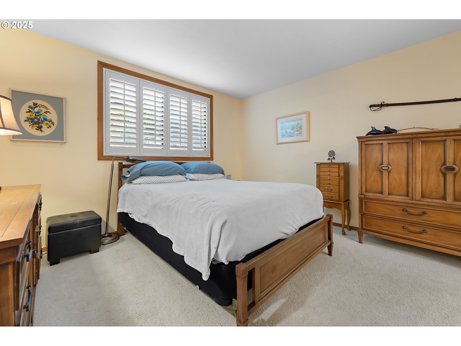 15435 Southwest 114th Court, Unit 99 Tigard, OR 97224 - Photo 19 of 40 a bedroom with a bed and a window