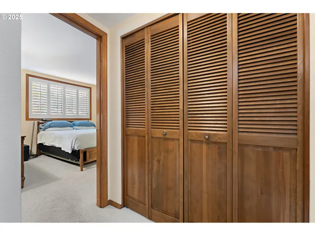 a bedroom with a balcony and a lamp