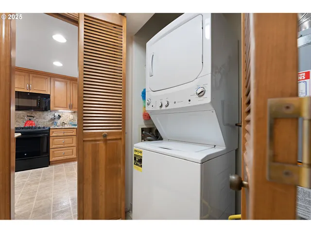 a kitchen view with a sink a stove and refrigerator