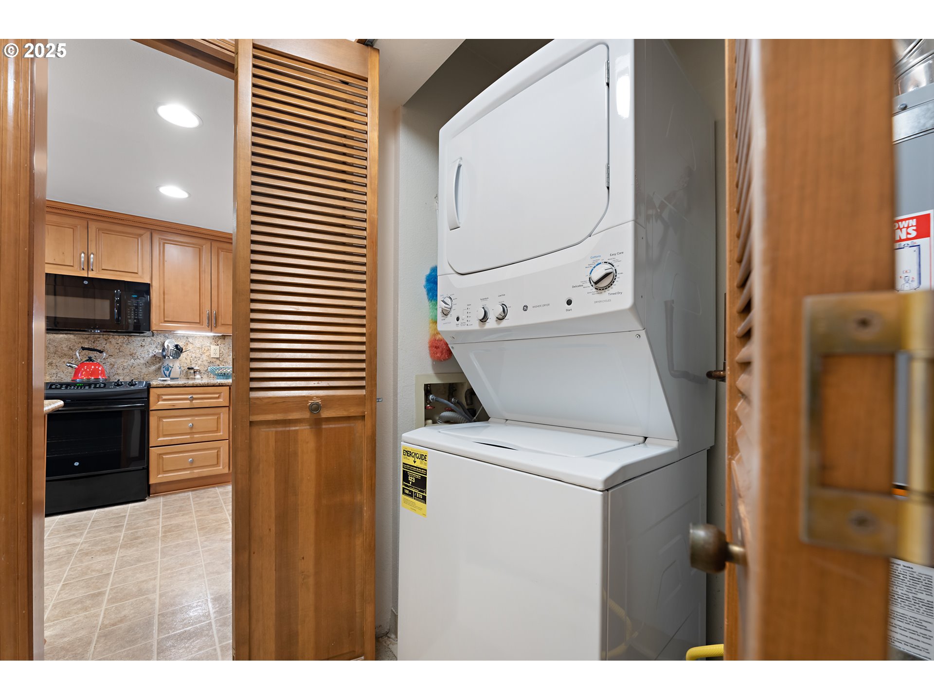 15435 Southwest 114th Court, Unit 99 Tigard, OR 97224 - Photo 27 of 40 a kitchen view with a sink a stove and refrigerator