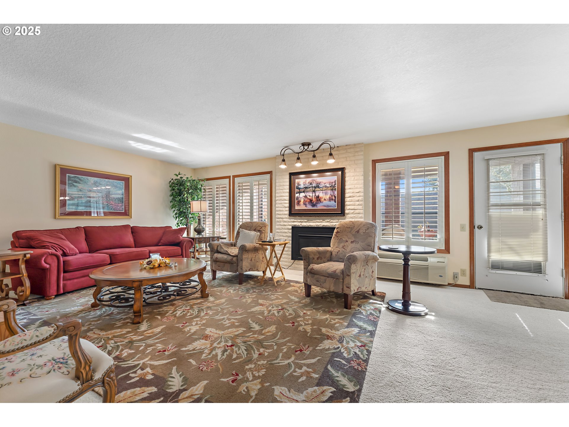 15435 Southwest 114th Court, Unit 99 Tigard, OR 97224 - Photo 5 of 40 a living room with furniture and a large window