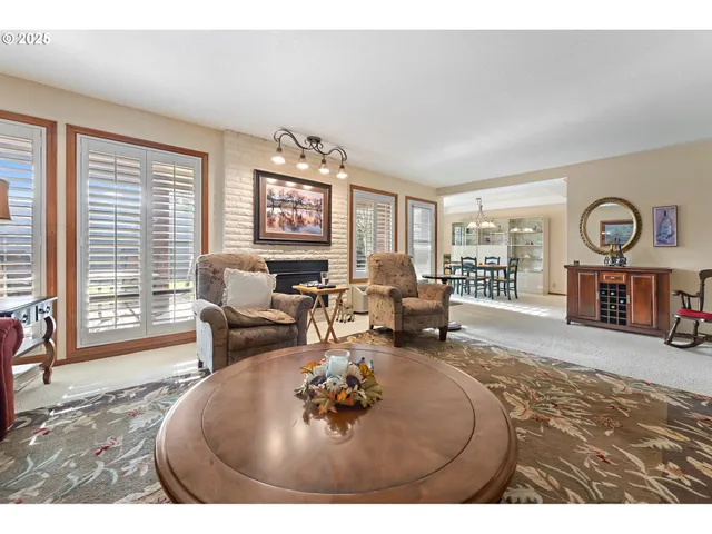 a living room with furniture window and wooden floor