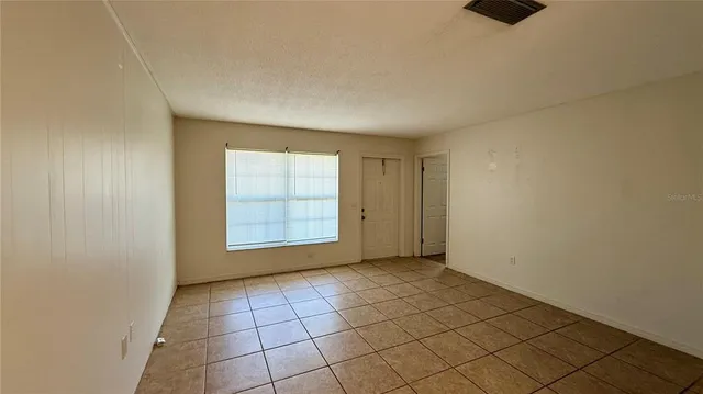 a view of an empty room and window