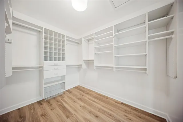 a bathroom with a shower and a mirror