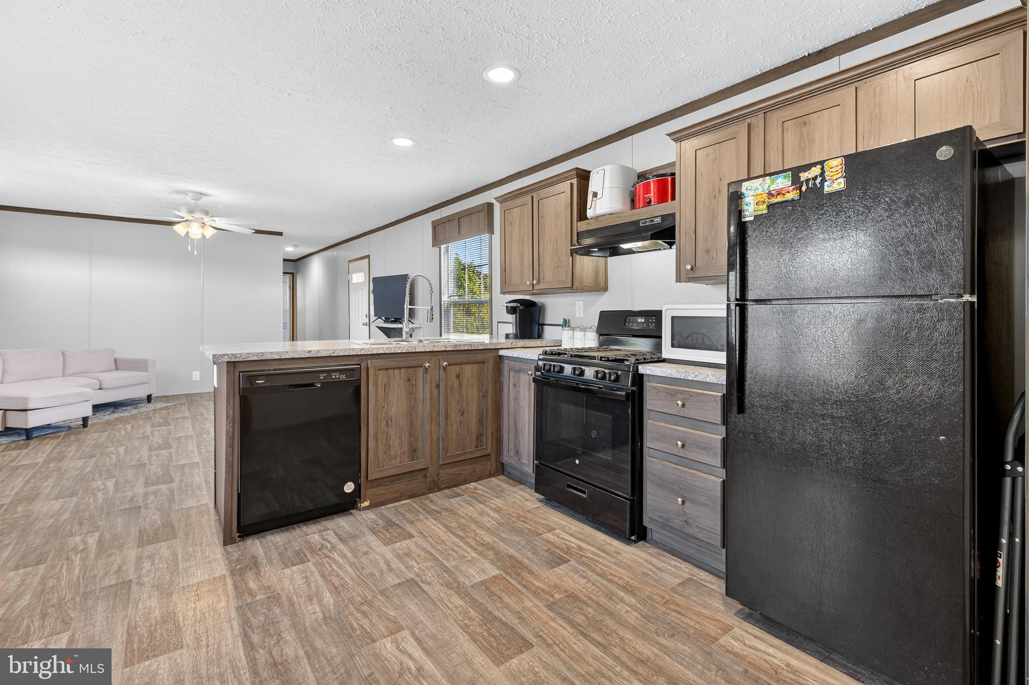 48 Dallas Drive Grantville, PA 17028 - Photo 9 of 30 a kitchen with stainless steel appliances granite countertop a refrigerator and a sink