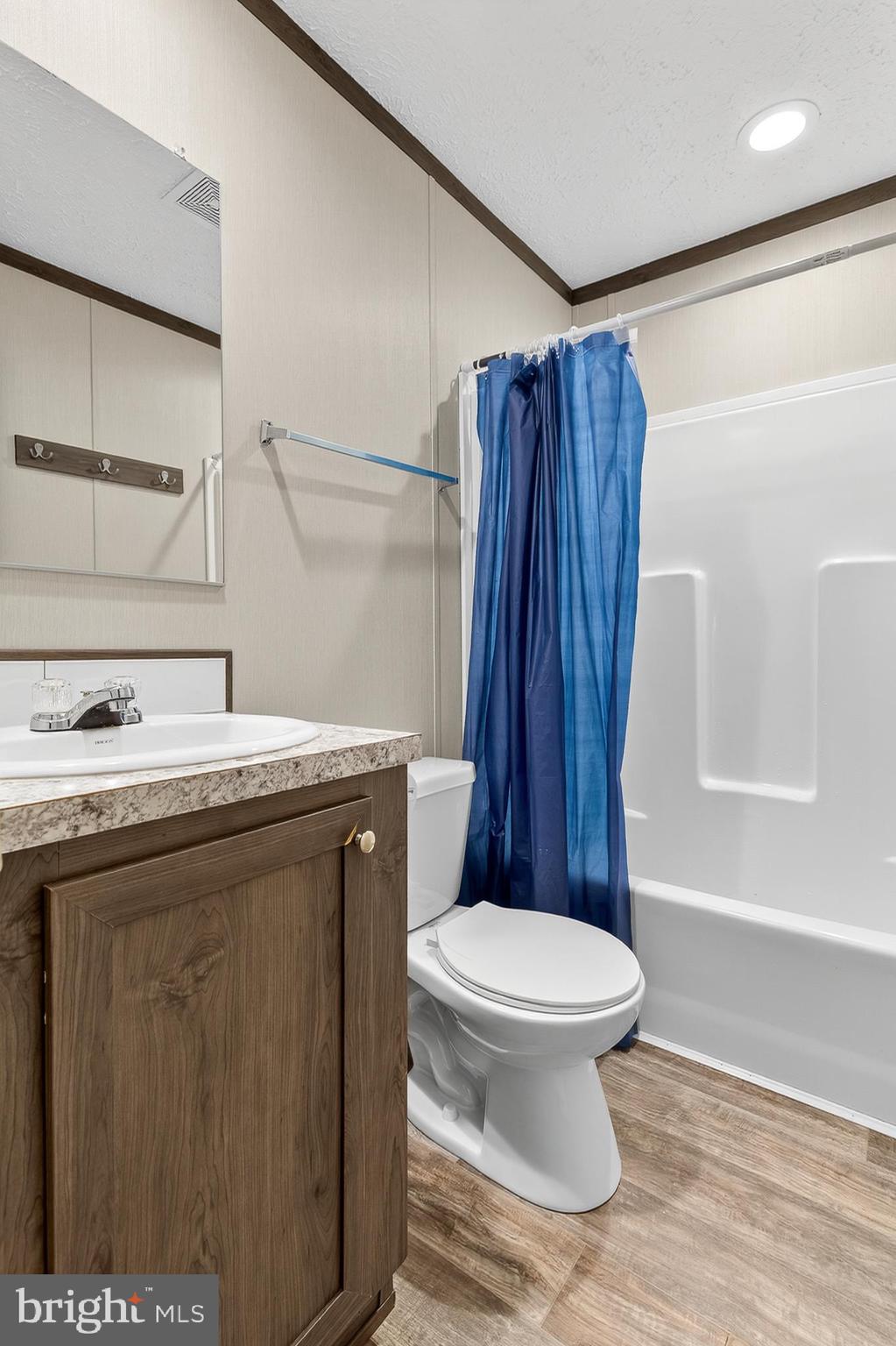 48 Dallas Drive Grantville, PA 17028 - Photo 20 of 30 a bathroom with a sink a toilet a mirror and shower