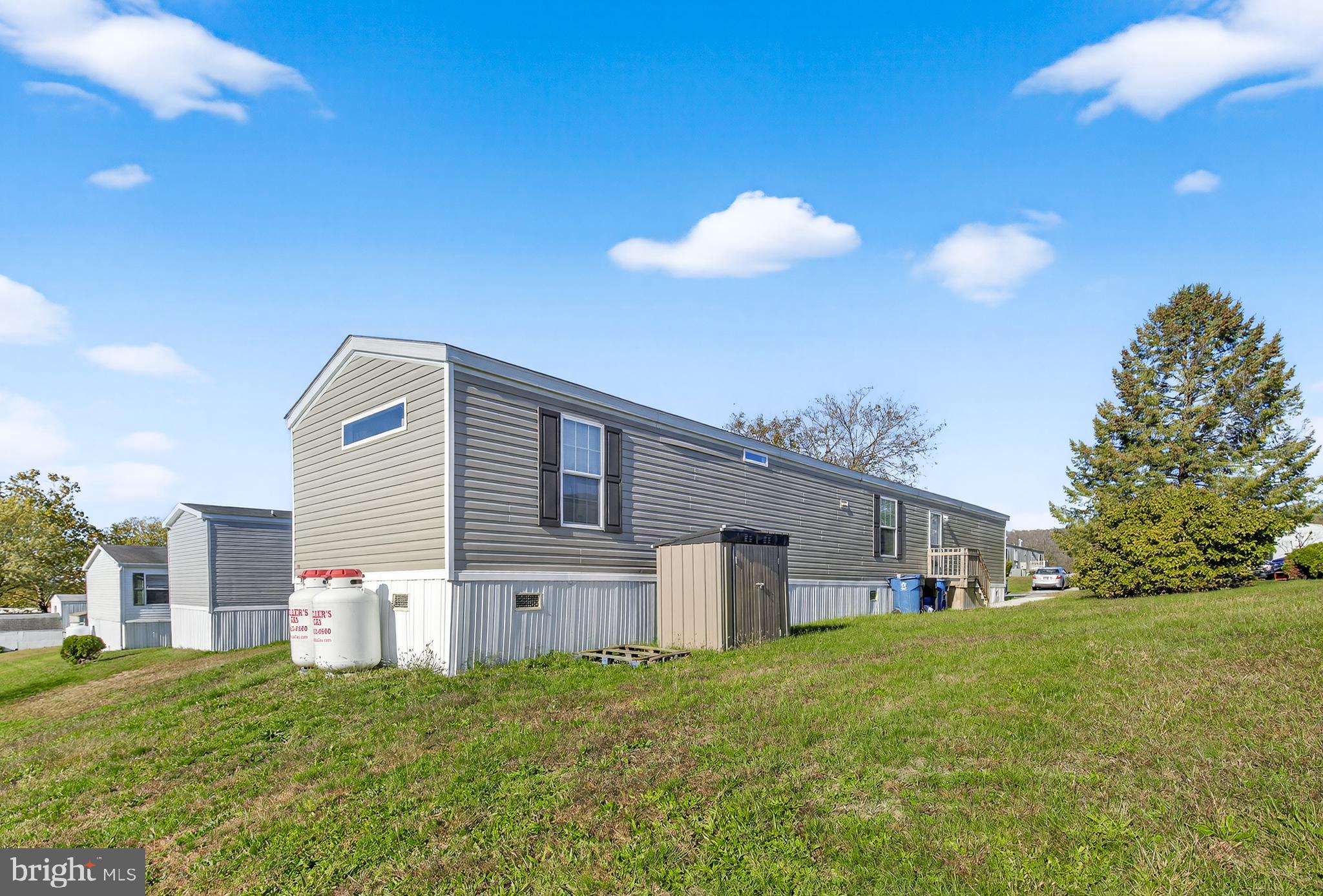 48 Dallas Drive Grantville, PA 17028 - Photo 3 of 30 a front view of a house with a yard and garage