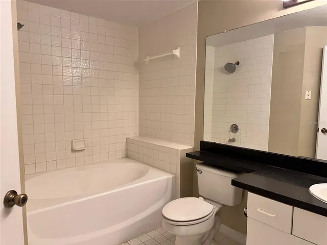 a bathroom with a toilet a sink and bathtub