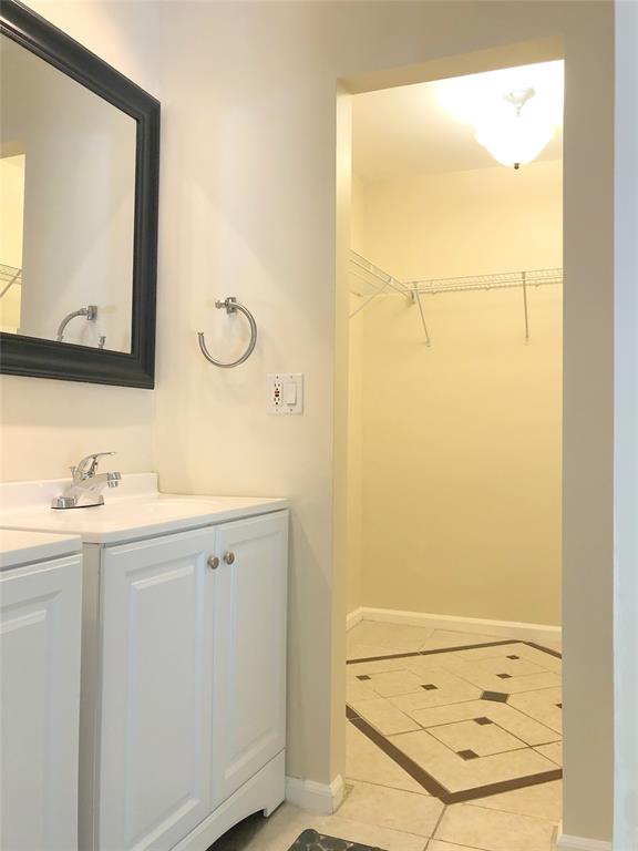 71 Laredo Lane Boca Raton, FL 33487 - Photo 15 of 18 a bathroom with a granite countertop sink and a mirror