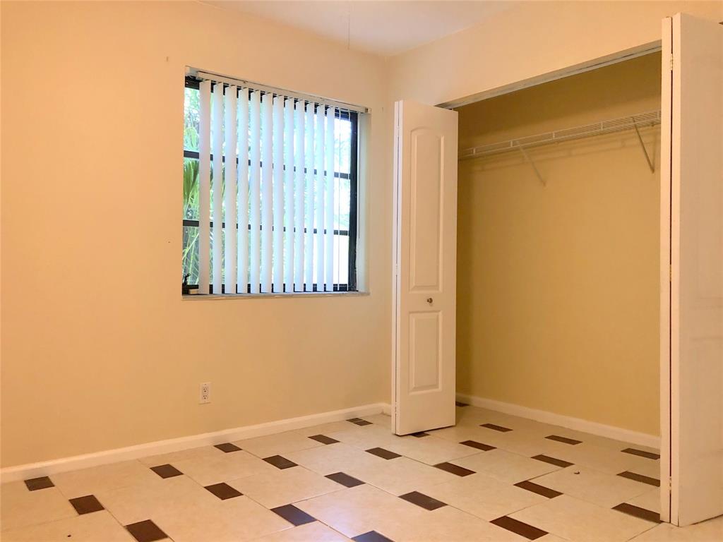71 Laredo Lane Boca Raton, FL 33487 - Photo 18 of 18 a bathroom with a sink and a mirror
