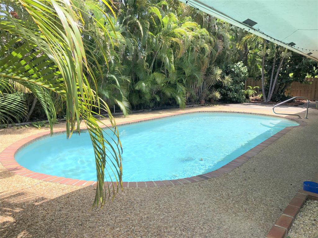 71 Laredo Lane Boca Raton, FL 33487 - Photo 4 of 18 a view of a swimming pool with an outdoor space