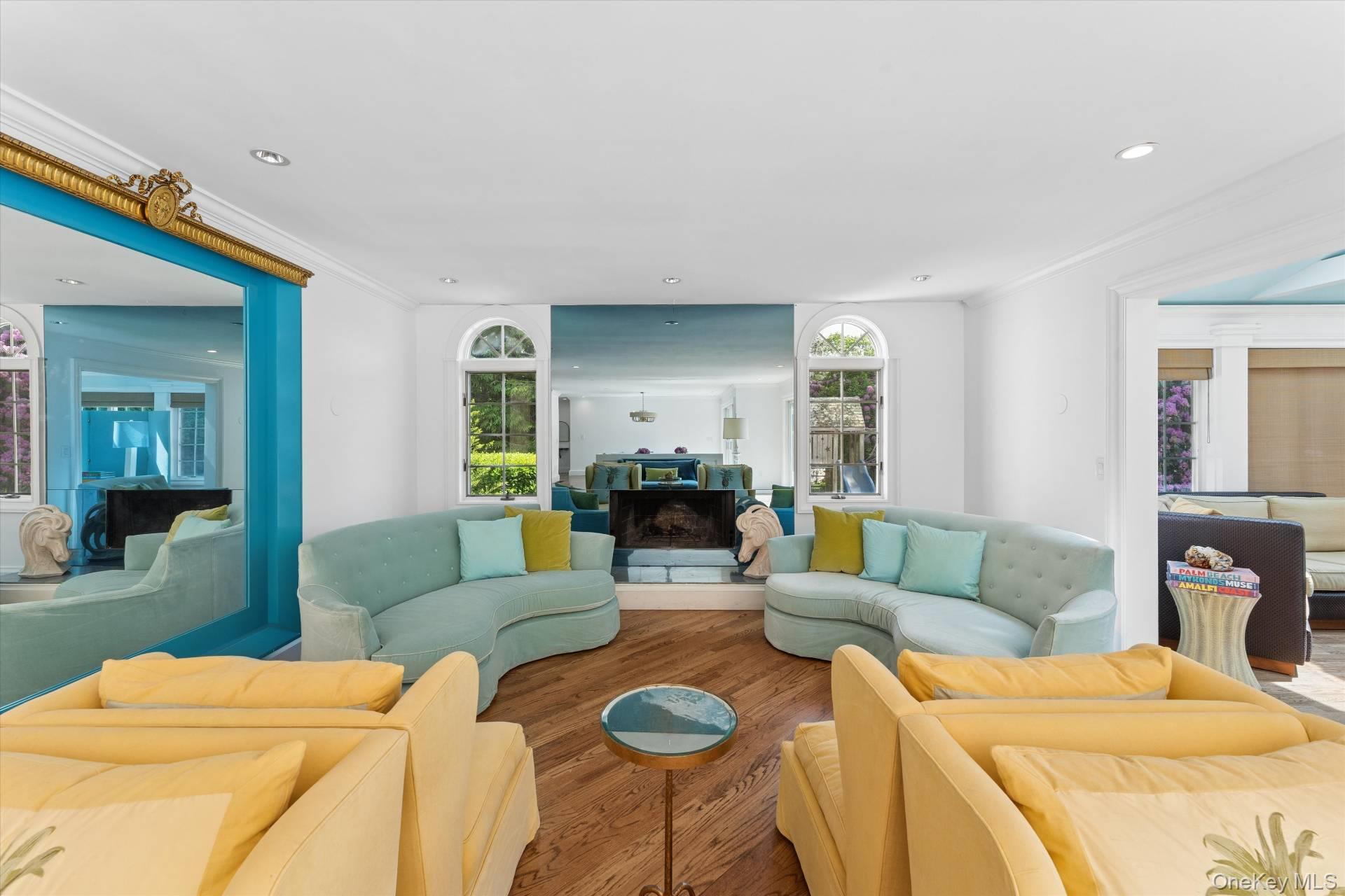 129 Oneck Lane Westhampton Beach, NY 11978 - Photo 10 of 32 a living room with furniture and a wooden floor