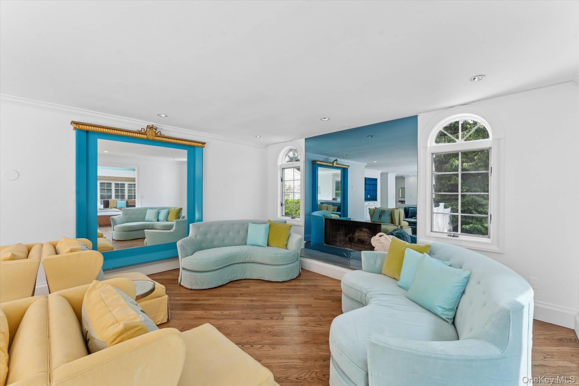 129 Oneck Lane Westhampton Beach, NY 11978 - Photo 11 of 32 a living room with furniture and a large window