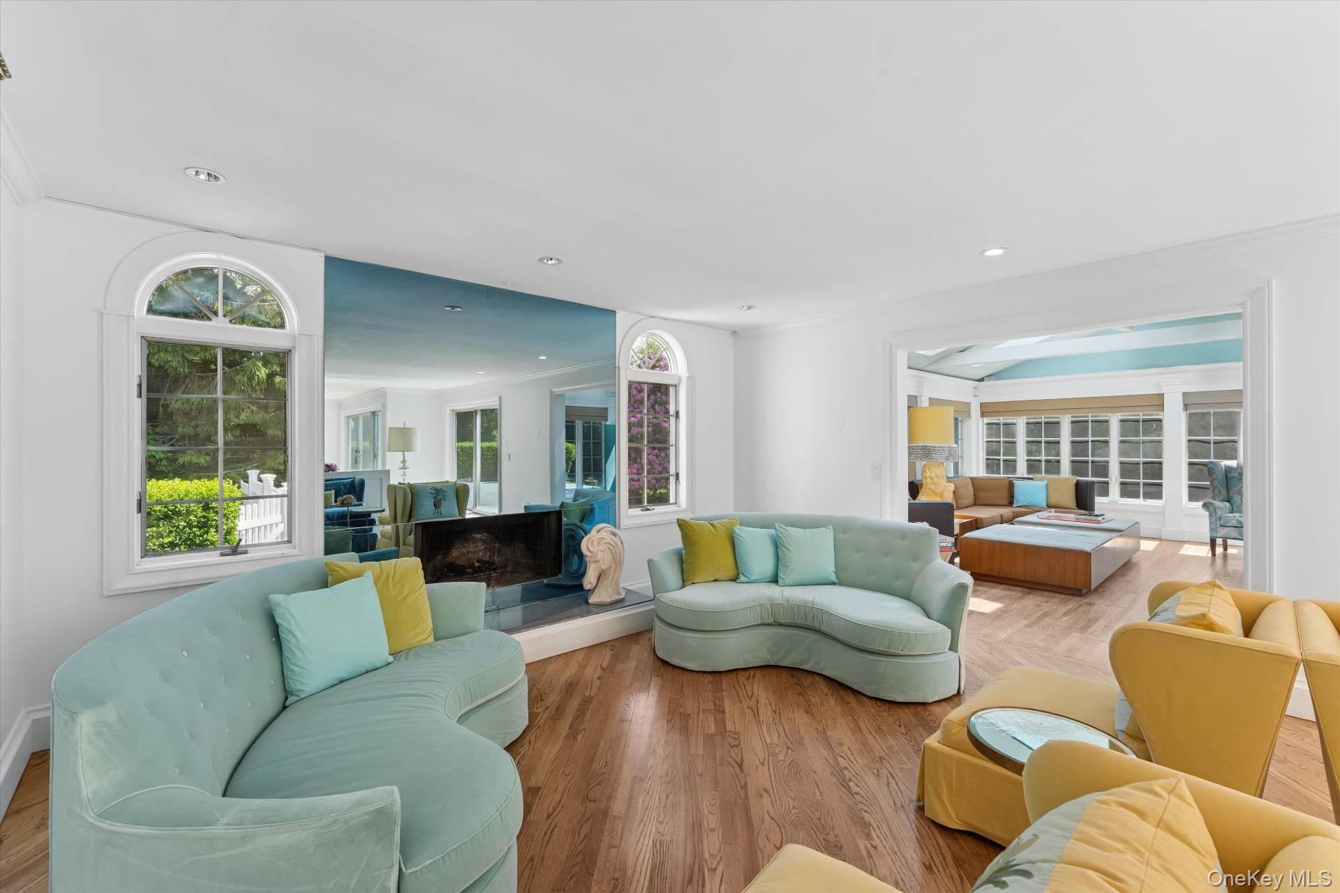 129 Oneck Lane Westhampton Beach, NY 11978 - Photo 12 of 32 a living room with furniture and a large window