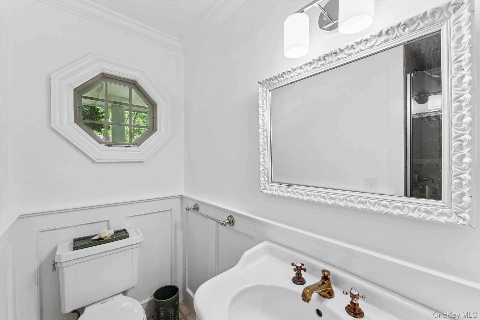 129 Oneck Lane Westhampton Beach, NY 11978 - Photo 20 of 32 a bathroom with a bathtub and a sink