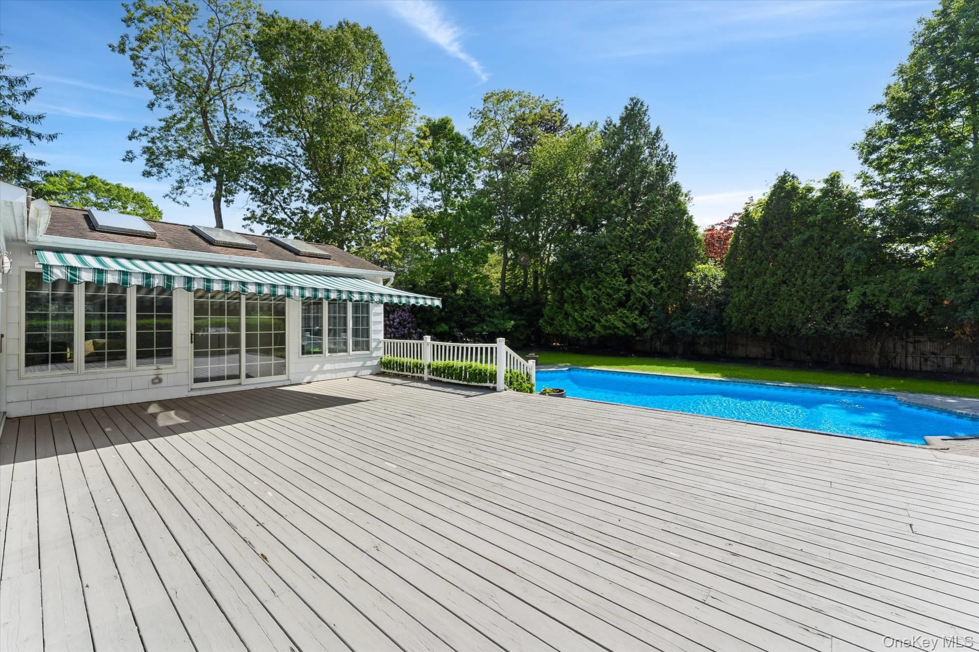 129 Oneck Lane Westhampton Beach, NY 11978 - Photo 24 of 32 a view of a house with a yard
