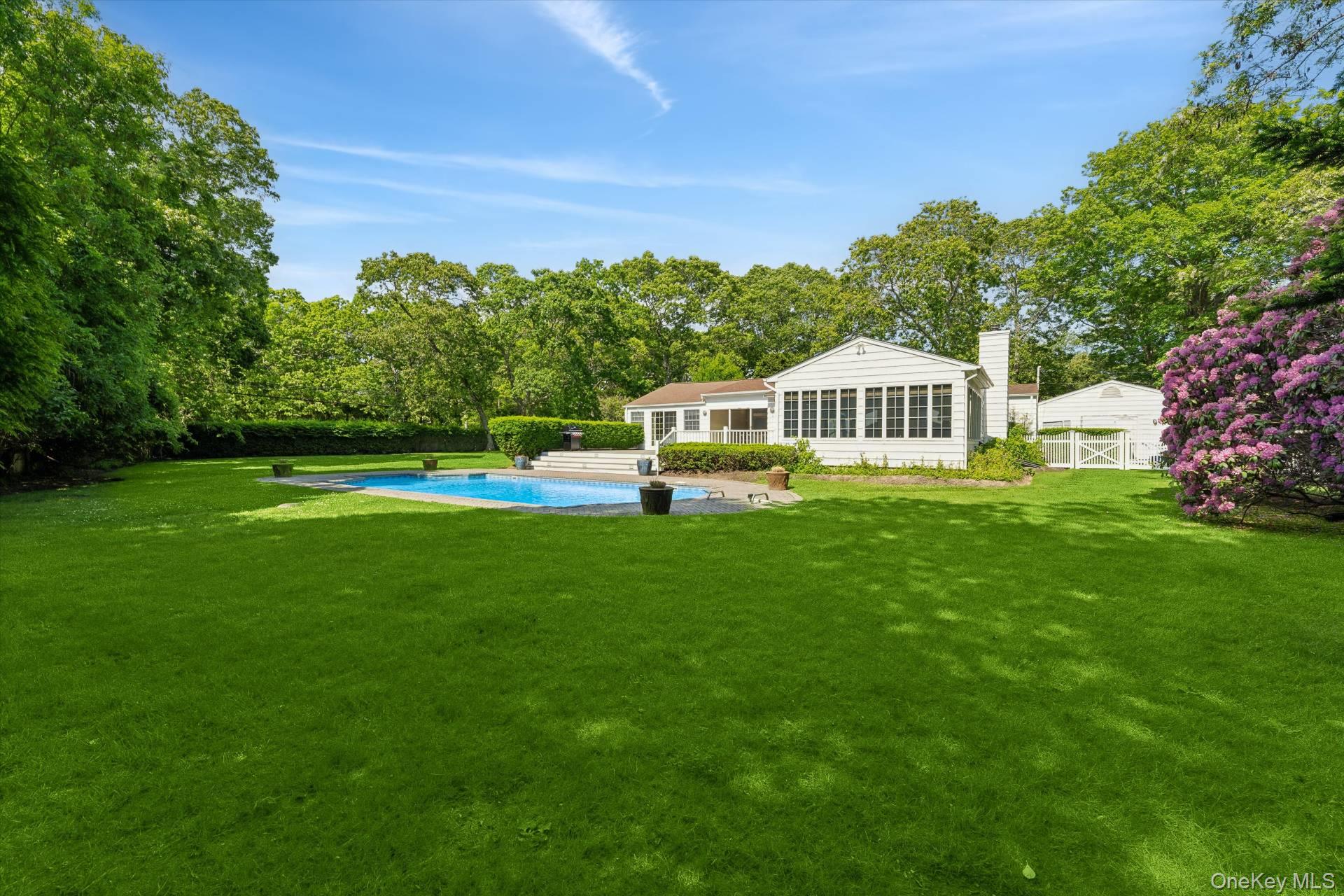 129 Oneck Lane Westhampton Beach, NY 11978 - Photo 27 of 32 a view of a house with a big yard