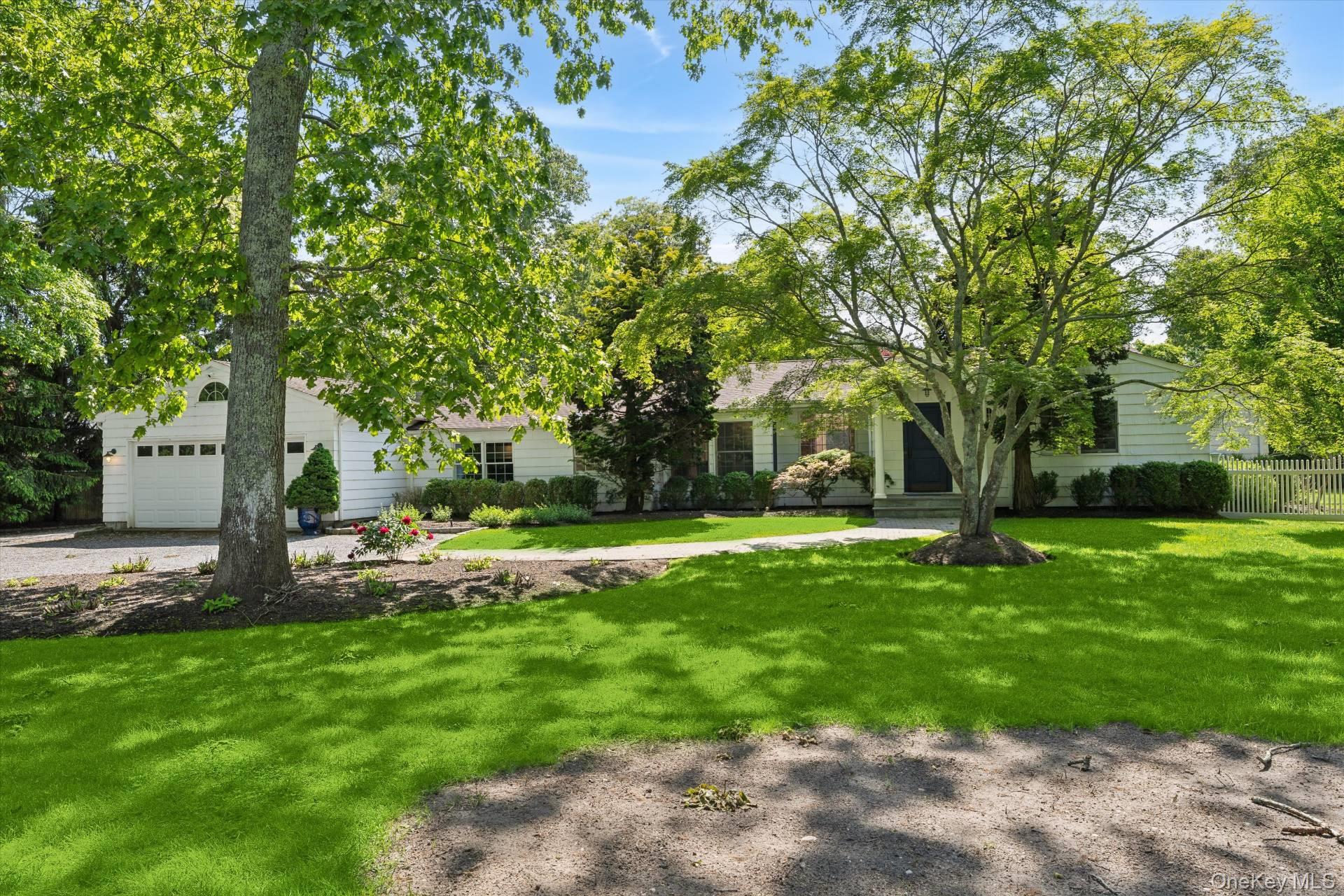 129 Oneck Lane Westhampton Beach, NY 11978 - Photo 29 of 32 a view of a backyard with a garden
