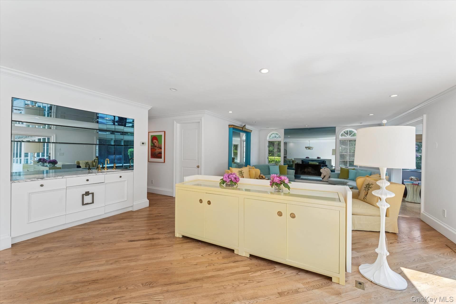 129 Oneck Lane Westhampton Beach, NY 11978 - Photo 32 of 32 a living room with furniture and flat screen tv