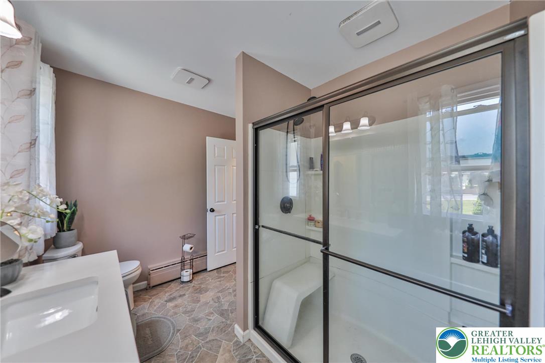 417 3rd Street Lehighton, PA 18235 - Photo 12 of 39 This functional bathroom features a clean vanity and a glass-enclosed shower.