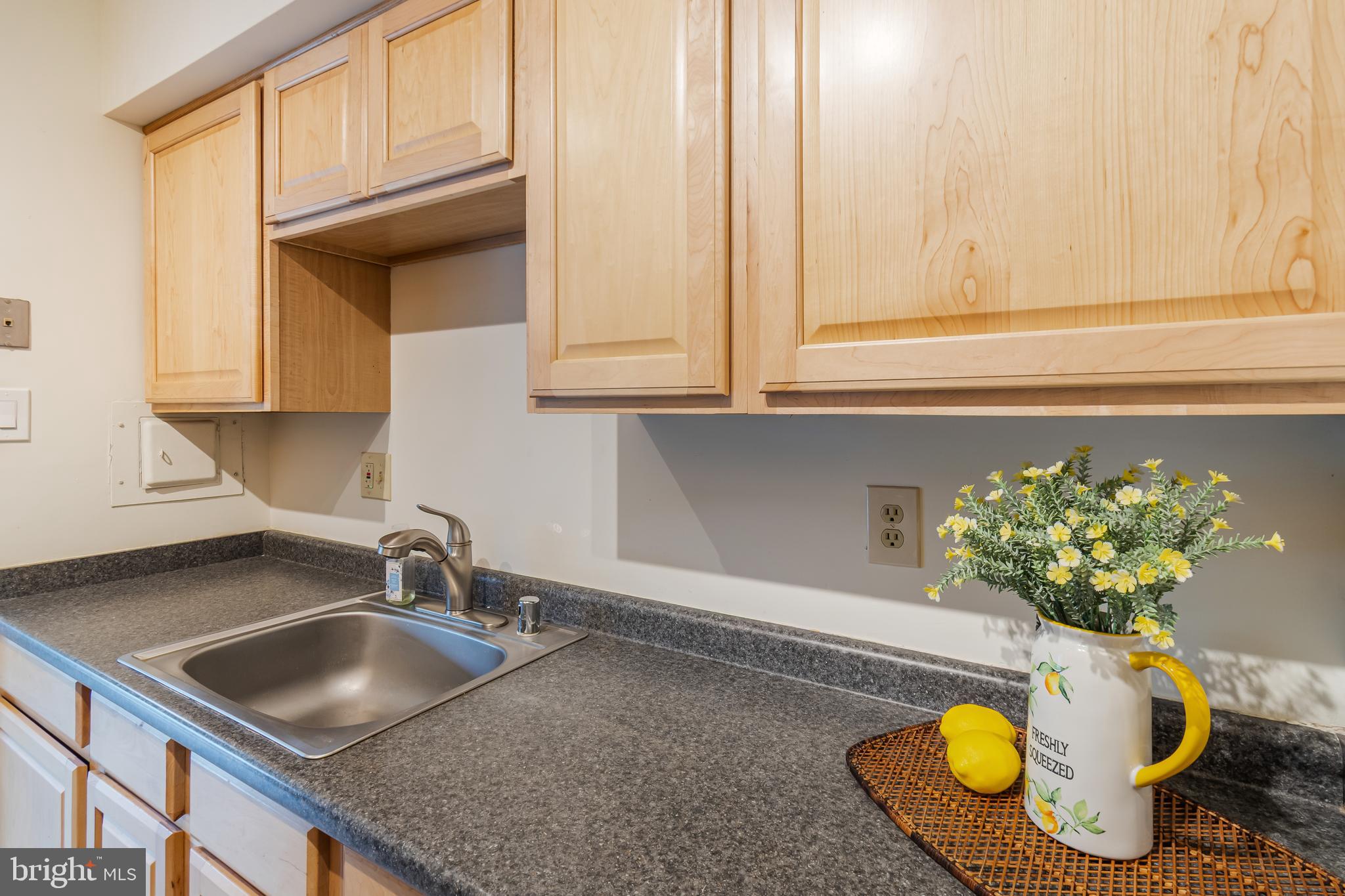 106 Mountain Road, Unit 1A Pasadena, MD 21122 - Photo 12 of 29 a bathroom with a sink a vanity and a window