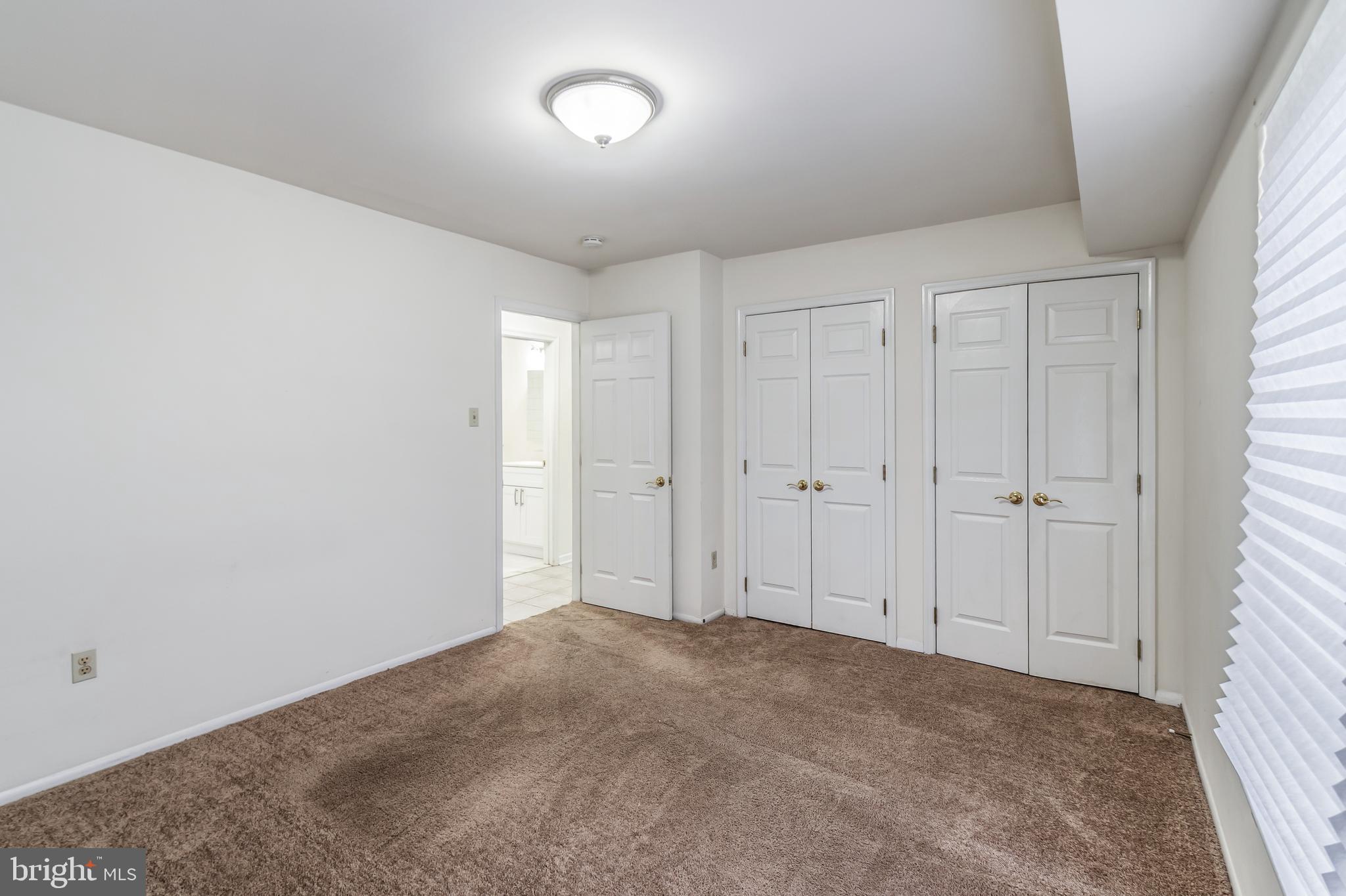 106 Mountain Road, Unit 1A Pasadena, MD 21122 - Photo 15 of 29 a view of an empty room and window