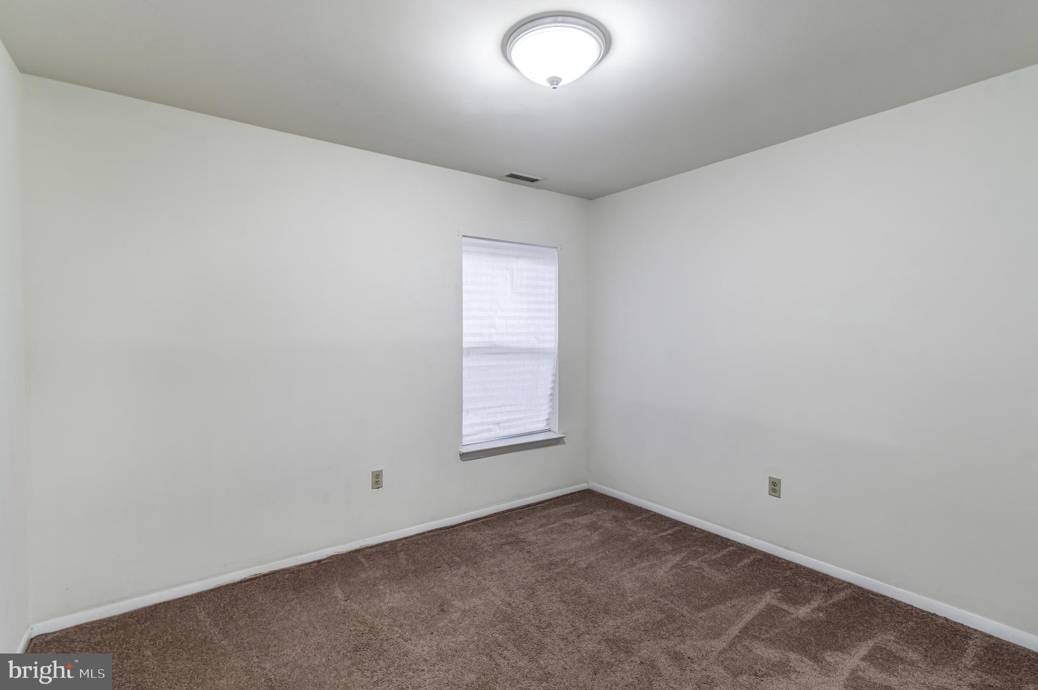 106 Mountain Road, Unit 1A Pasadena, MD 21122 - Photo 19 of 29 an empty room with a window