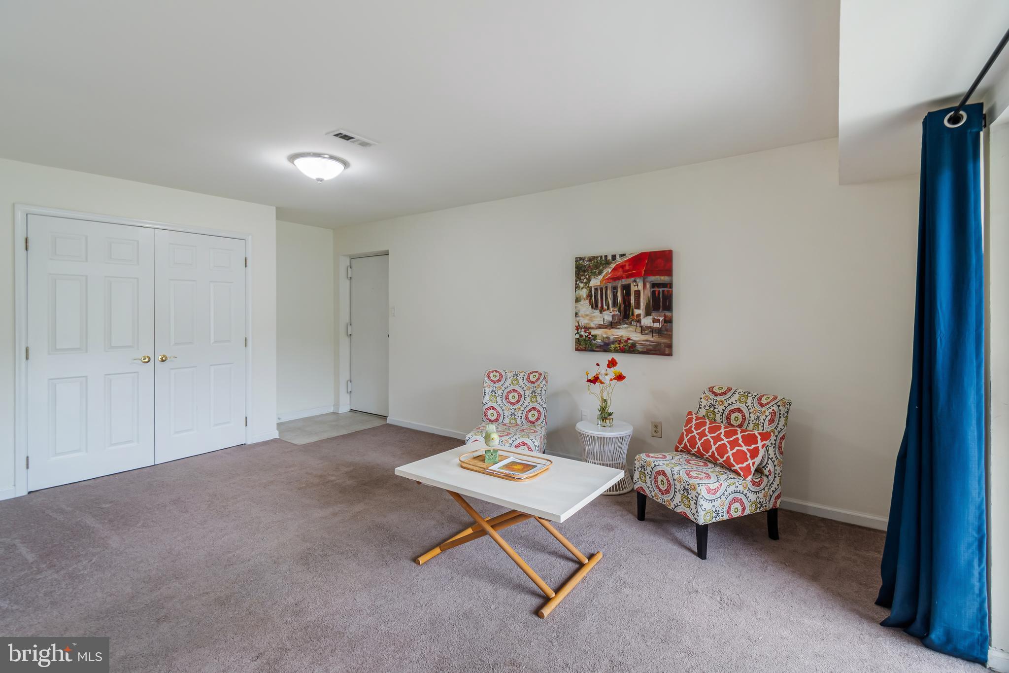106 Mountain Road, Unit 1A Pasadena, MD 21122 - Photo 2 of 29 a living room with furniture