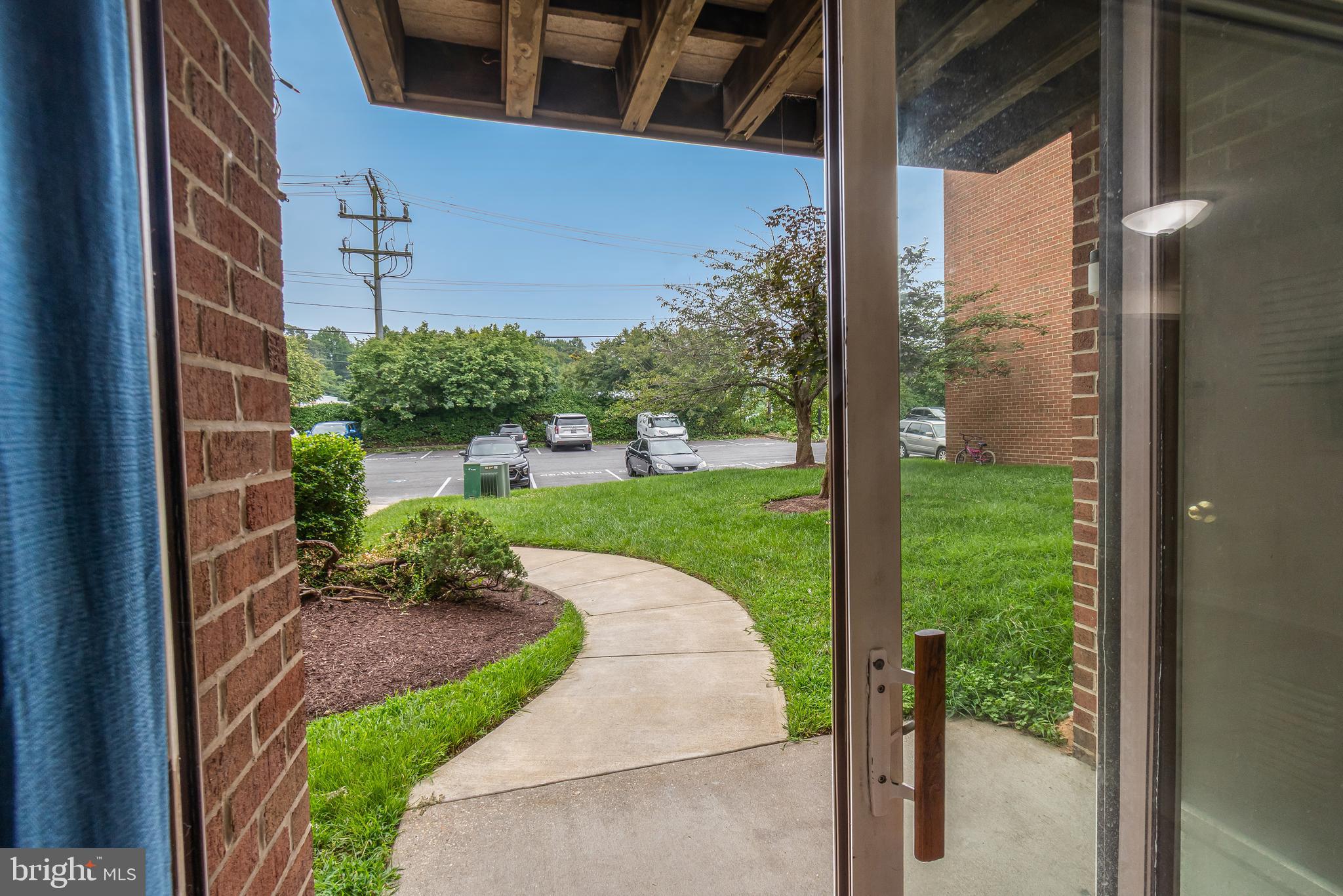 106 Mountain Road, Unit 1A Pasadena, MD 21122 - Photo 23 of 29 a view of a porch with a yard