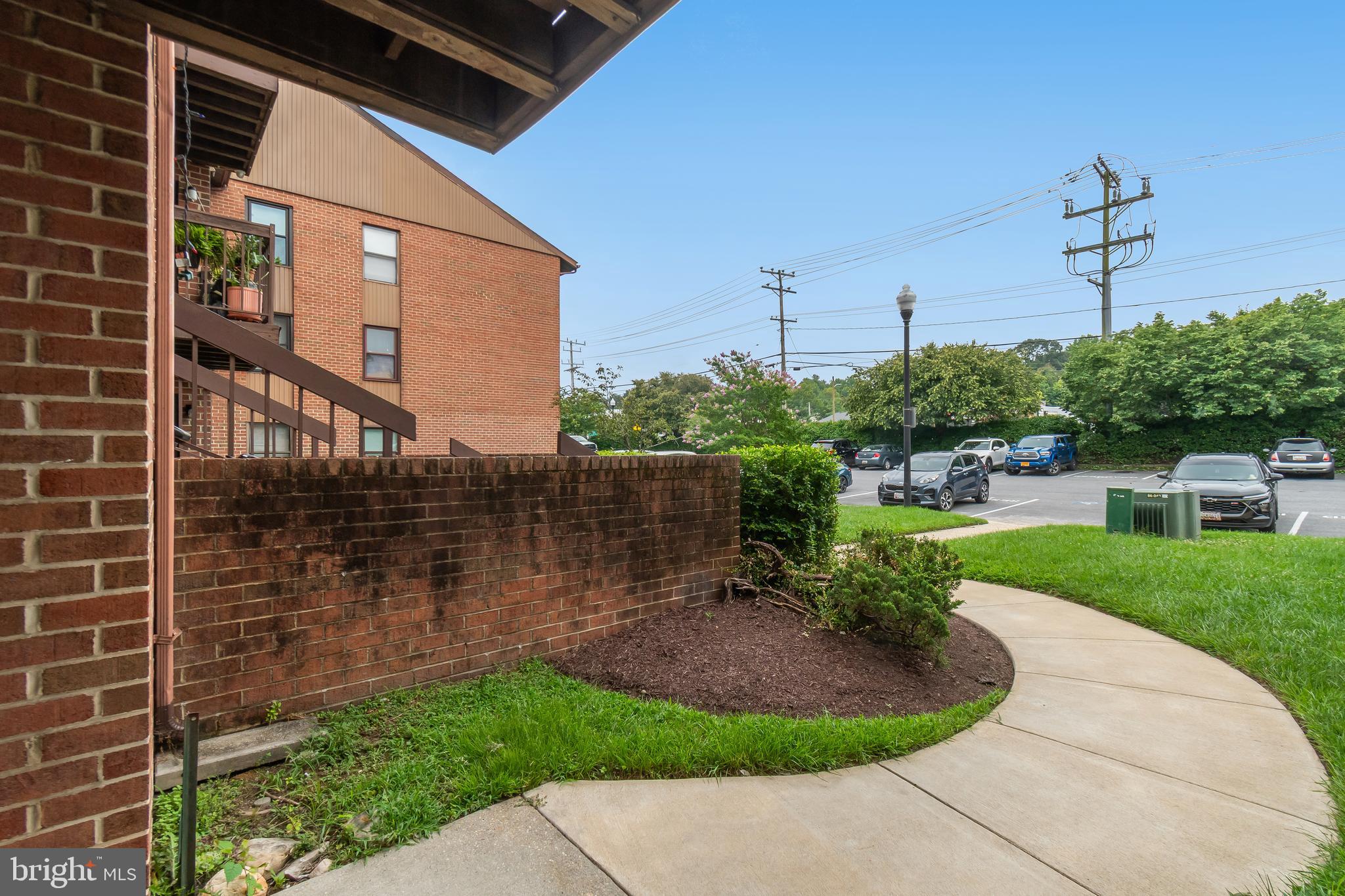 106 Mountain Road, Unit 1A Pasadena, MD 21122 - Photo 24 of 29 a view of a patio with a yard