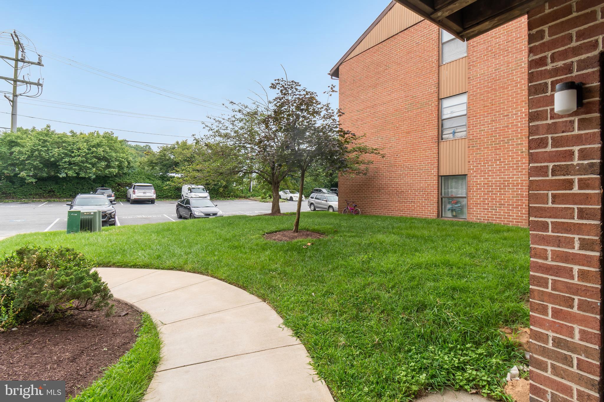 106 Mountain Road, Unit 1A Pasadena, MD 21122 - Photo 25 of 29 a view of a backyard with plants and a garden